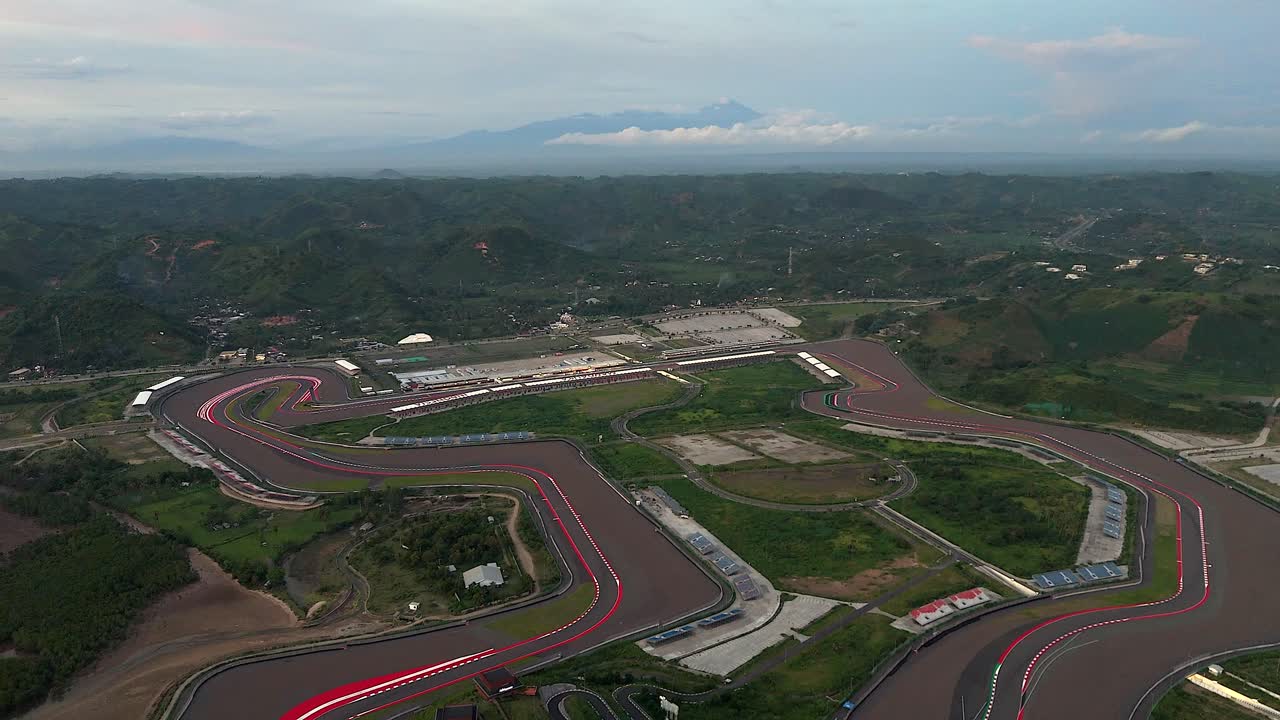 Humid hazy flyover of international motorcycle race track on Lombok