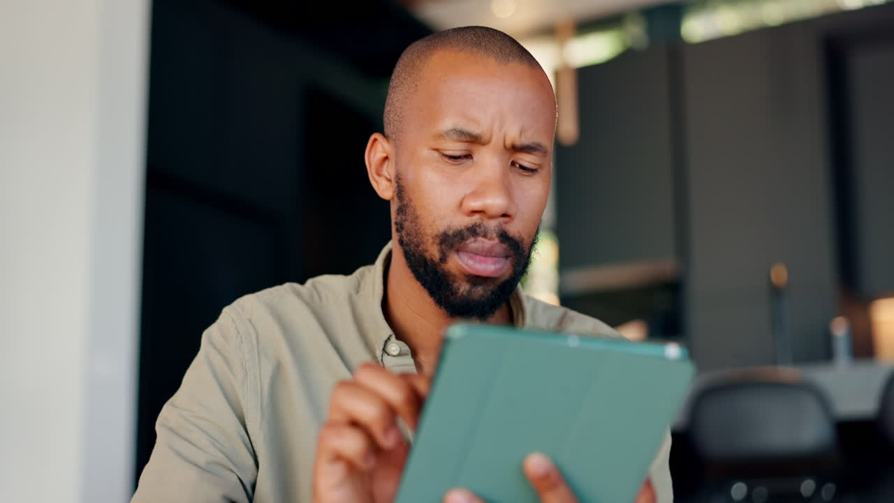 Man using a tablet indoors