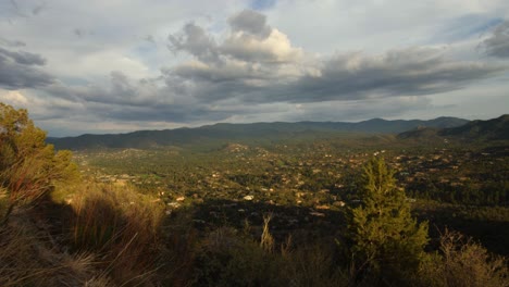 Storm-clouds-gather-over-Prescott-homes-in-the-mountains-during-sunset