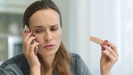 closeup worried woman getting bad news on phone call.