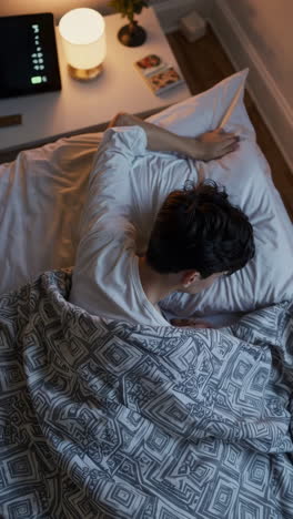 a person sleeping soundly in bed