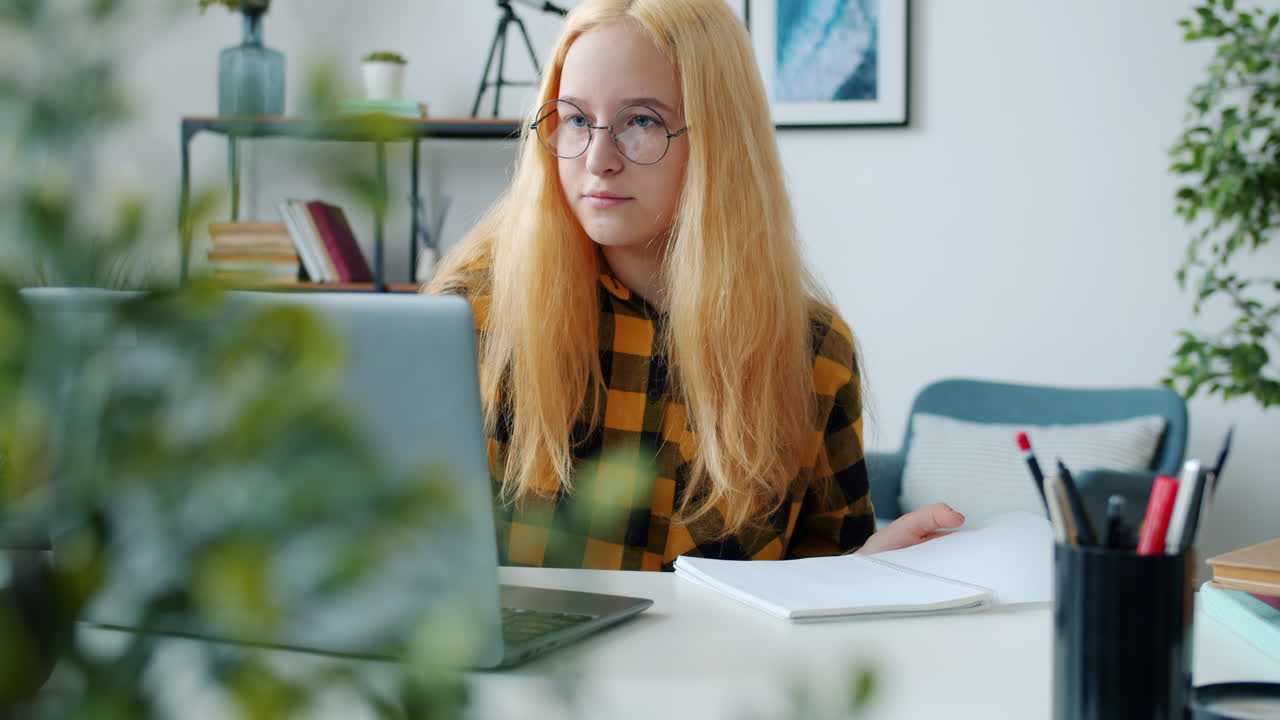Teenage Girl Studying at Home
