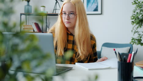 teenage girl studying at home
