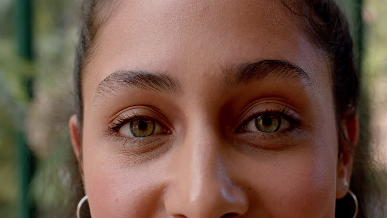 Close-up of smiling person with clear skin and bright eyes