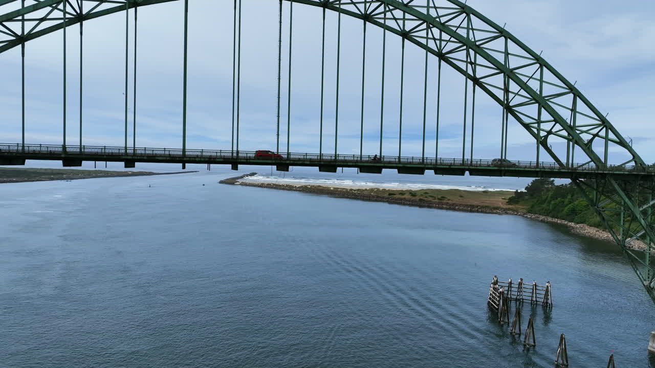 Aerial view rising in front of the Yaquina Bay Bridge, in Newport, Oregon, USA