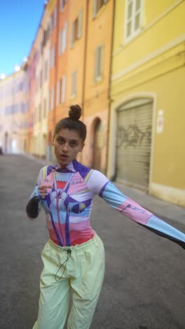 young woman in stylish outfit in a colorful urban street