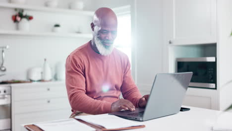 Senior-man,-laptop-and-remote-working-in-kitchen