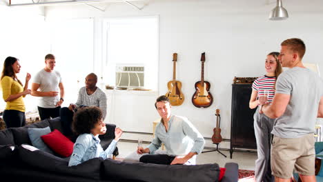 young adult friends socialising in a brooklyn apartment