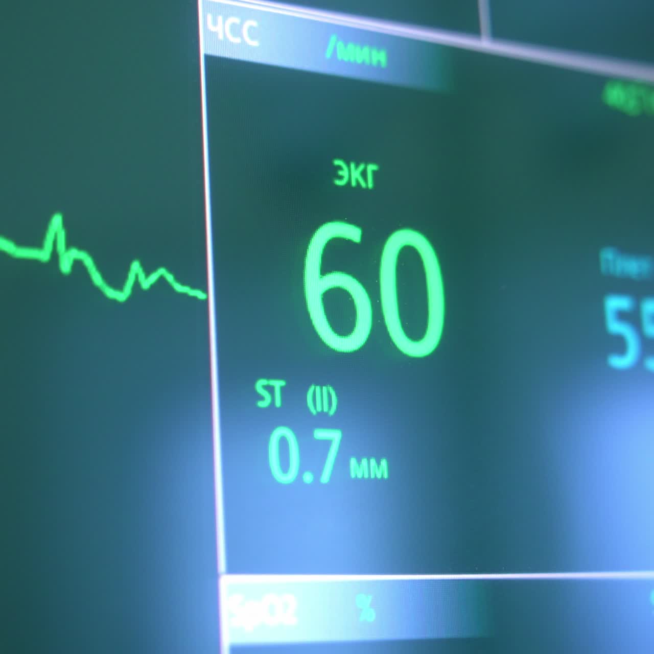 Numbers displaying heart rate of a patient under operation on the screen of equipment. Modern surgery room appliances. Close up