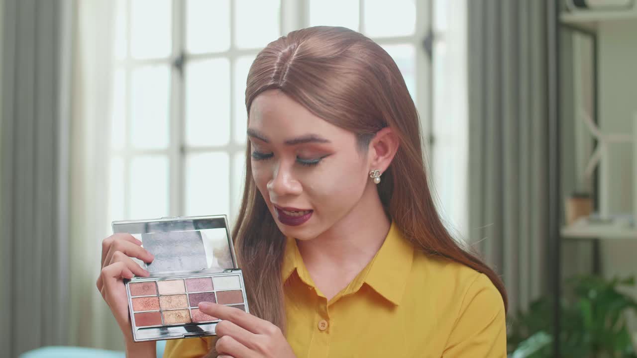 Influencer Young Transgender Woman Blogger Talks About Makeup. Blogger Talks Facial Beauty Treatments. Vlogger Broadcasts How To Use Of Cosmetic In Home Studio