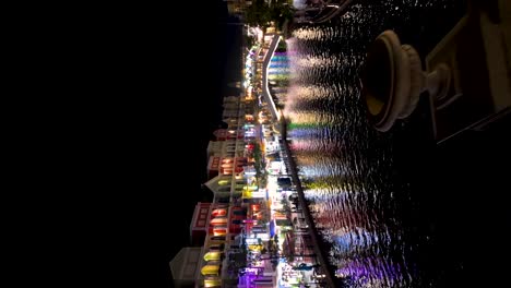 vertical aerial shot of a tourist walking on a bridge at Grand World in Vietnam