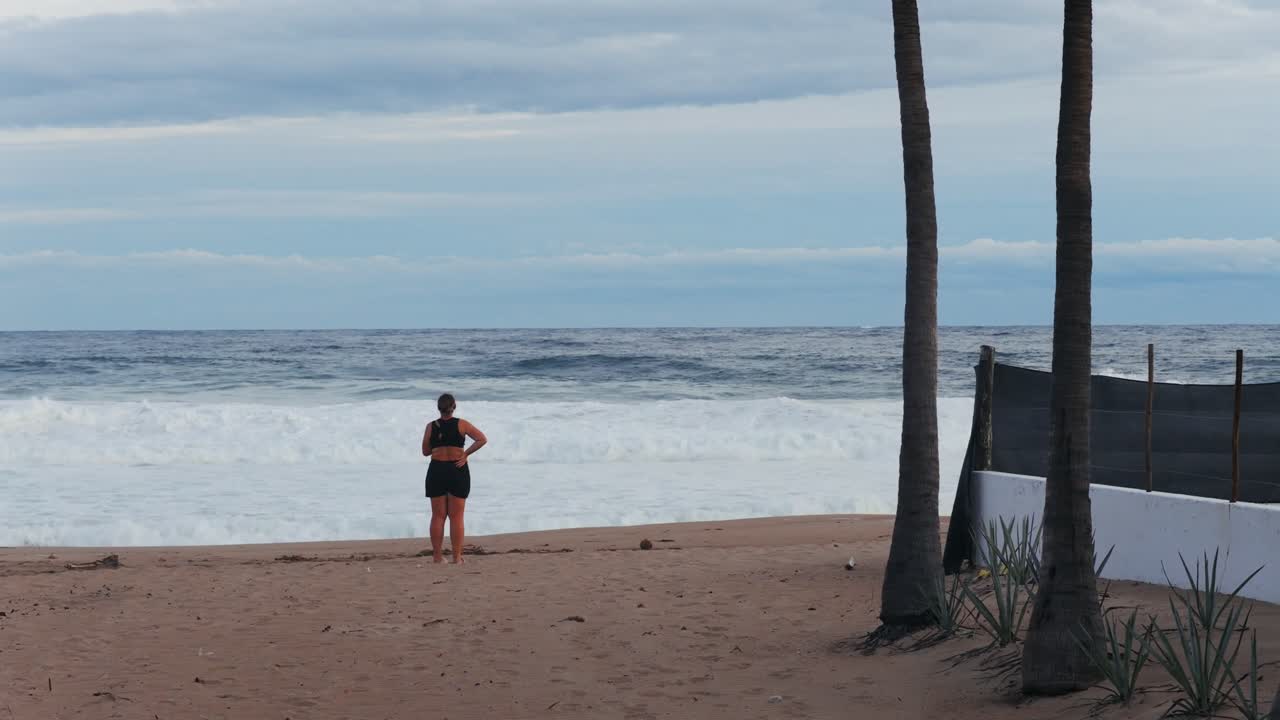 Woman gazing at ocean view in Punta Perula, Jalisco, Mexico, tranquil scene