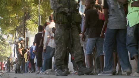 long lines of refugees wait on the streets of haiti following their devastating earthquake 2