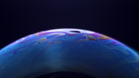 beautiful blue bubble planet in black background - close up