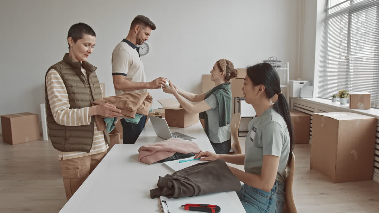 Group of people packing and moving