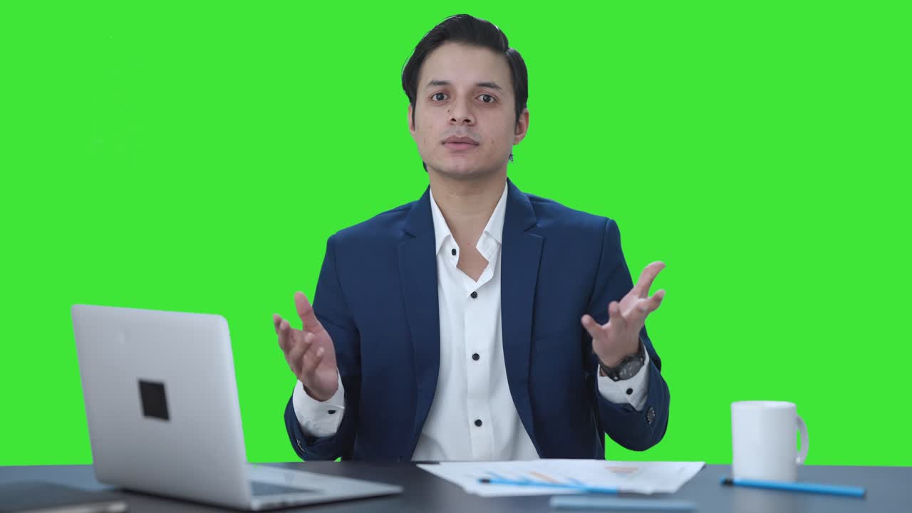 Indian manager talking to someone Green screen