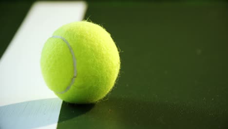 Close-up-of-tennis-ball-near-white-line-4k
