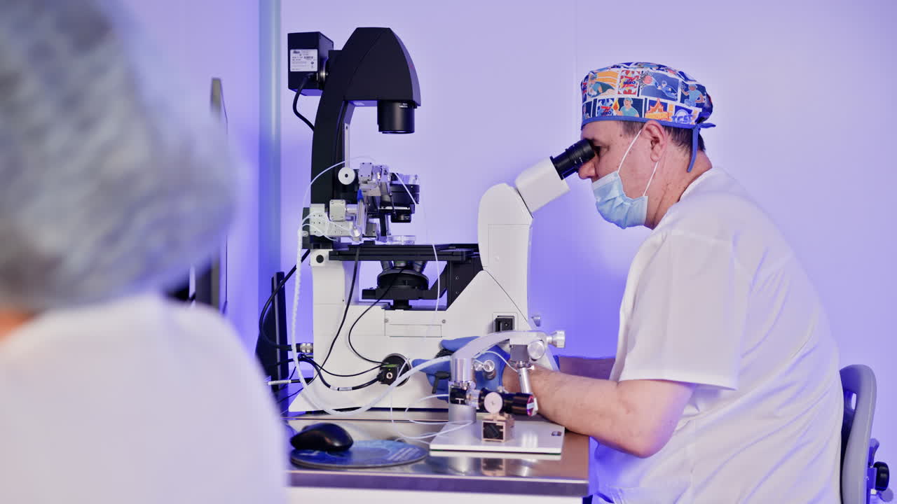 Scientist using a microscope in a laboratory setting