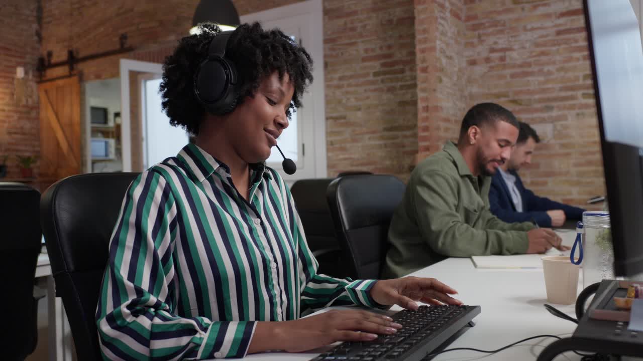 Call center employees working in office