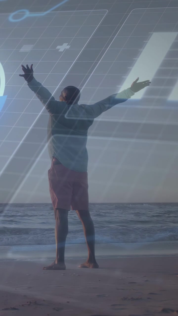 Vídeo vertical: Homem idoso levantando os braços na praia, gerando grade de RA tecnológica e anel visualizando dados.