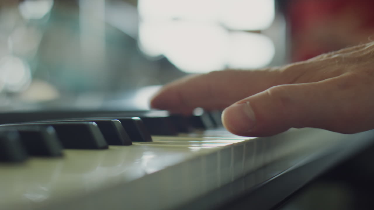 Close-up of hands playing a piano or keyboard