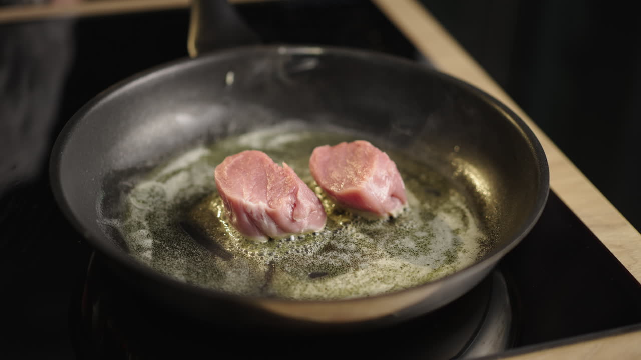 Cooking pork in a frying pan