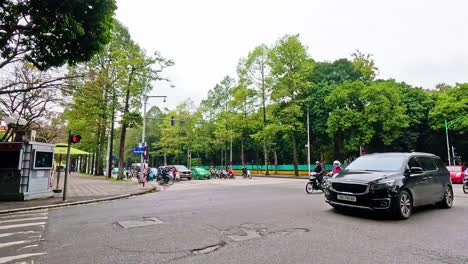 traffic flows through a bustling hanoi intersection