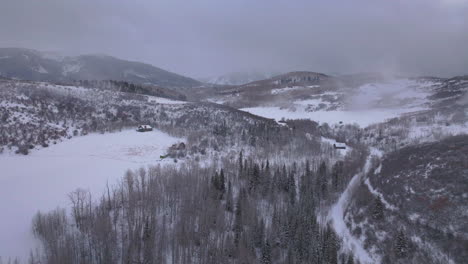 Aspen-Snowmass-Pitkin-county-cabin-wilderness-aerial-drone-Rocky-Mountains-Colorado-Basalt-Carbondale-Mt-Sopris-Maroon-Bells-Ashcroft-Independence-Pass-foggy-snowy-morning-cloudy-forward-pan-up-motion