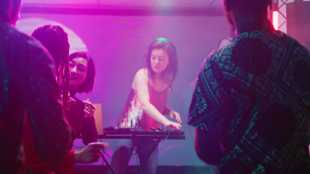 People Enjoying a Party with a DJ