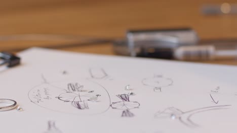 Diamonds-landing-on-paper-in-slowmotion