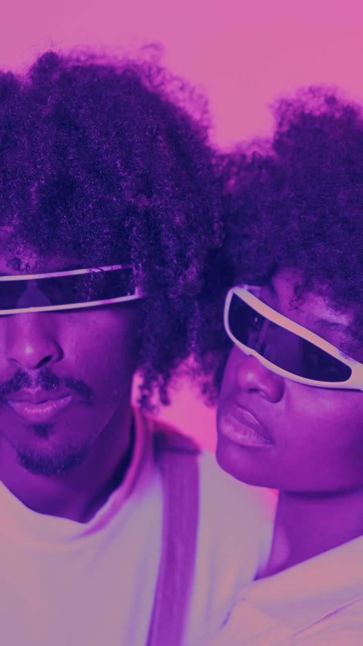 Couple with Afros and Futuristic Purple Sunglasses