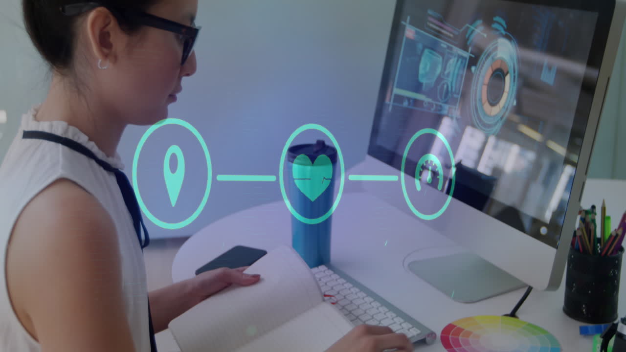 Animation of network of digital icons against asian woman taking notes at office