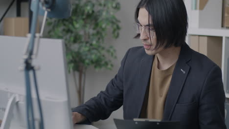 businessperson working at a computer in an office