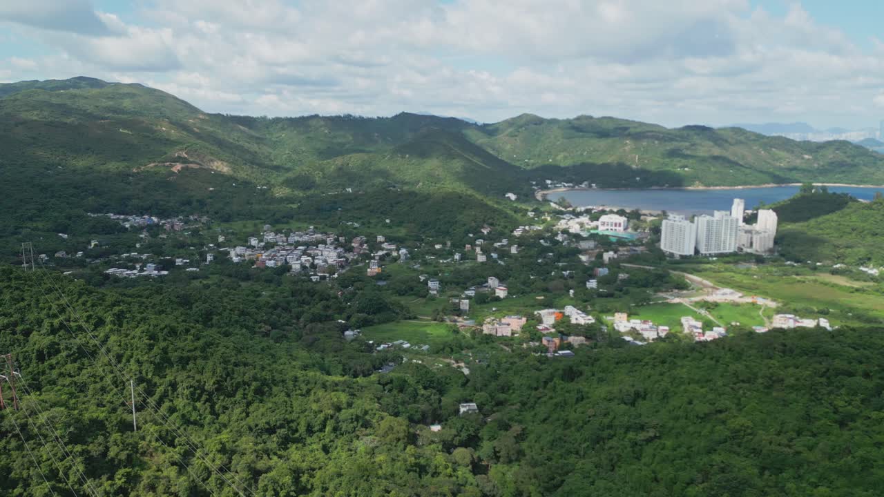 Footage of Mui Wo, a rural town on Lantau Island in Hong Kong, featuring coastal scenery, traditional buildings, lush greenery, and the serene lifestyle of this eastern coastal town