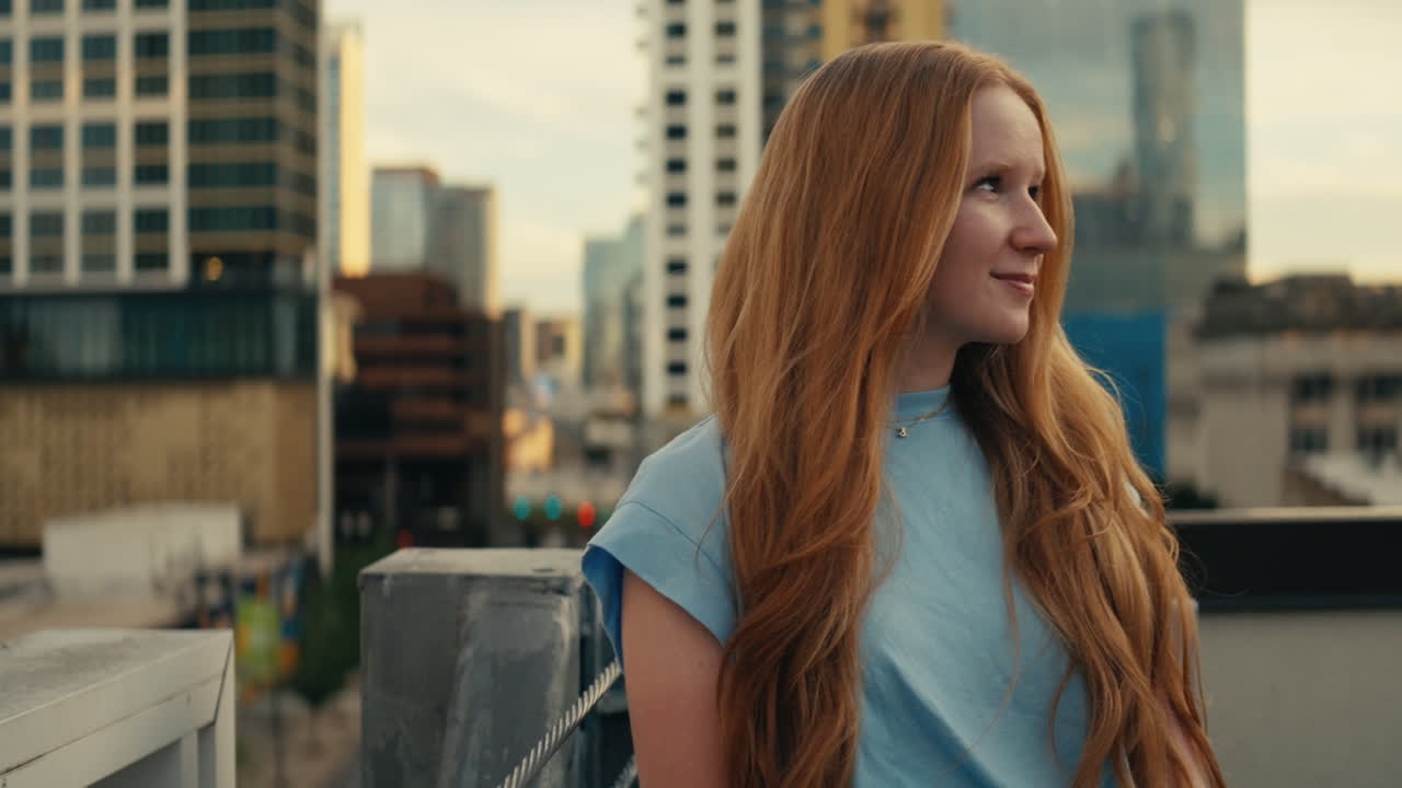 Redhead Woman on Rooftop in City