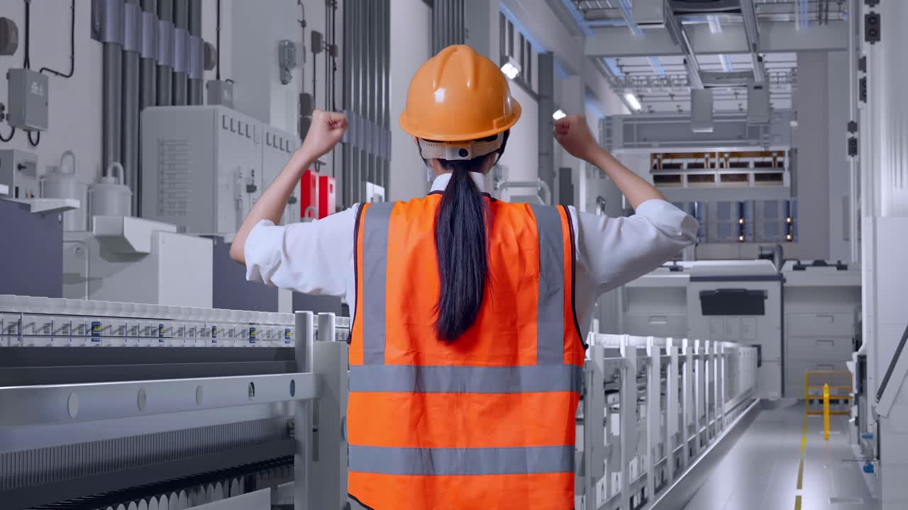 Factory Worker Celebrating Success on Production Line