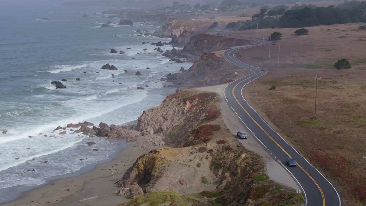 Scenic California coast highway 1 winding along rugged cliffs, peaceful day