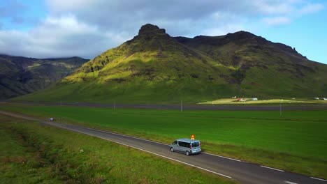 van driving on the road towards seljavallalaug pool in southern iceland