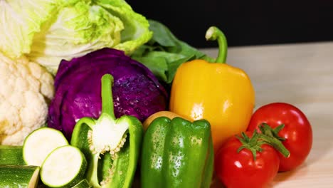 assorted vegetables arranged against a black background