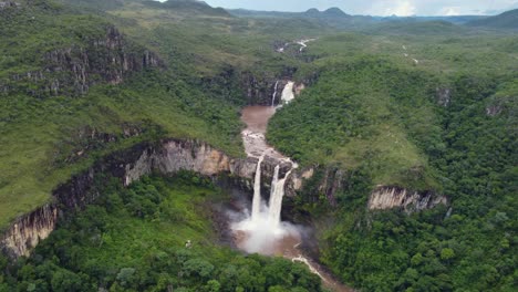 aerial view of a huge double waterfall in the forest - chapada dos veadeiros, goias - brazil