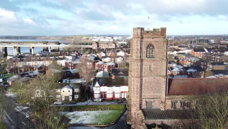 aerial rising view industrial small town frosty church rooftops neighbourhood north west england