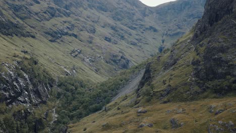 close circling left shot of the three sisters near glencoe, vibrant rugged mountains
