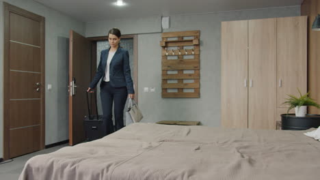 businesswoman checking out of hotel room