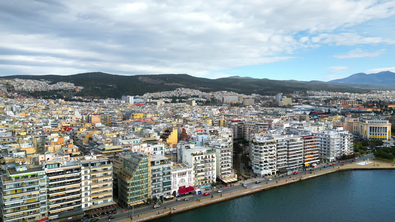Aerial drone view of Thessaloniki coastline. Green hills in background. The Aegean Sea in Central Macedonia in Greece