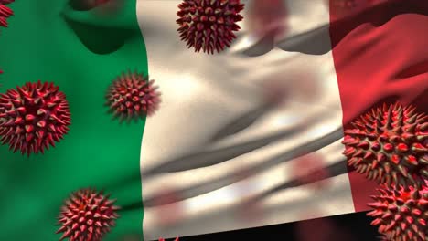 Animación-De-Células-Macro-Coronavirus-Covid-19-Que-Se-Extienden-Sobre-La-Bandera-Italiana-Ondeando