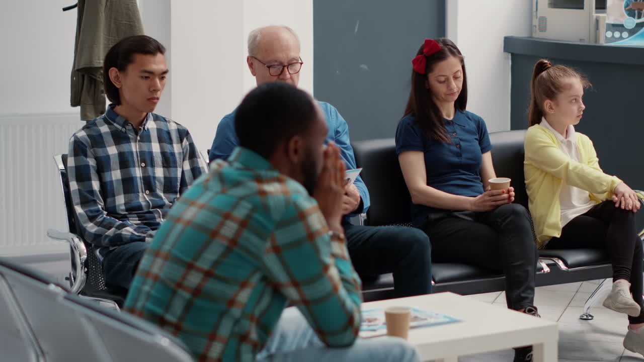 Diverse Group of Patients Waiting in Hospital Waiting Room