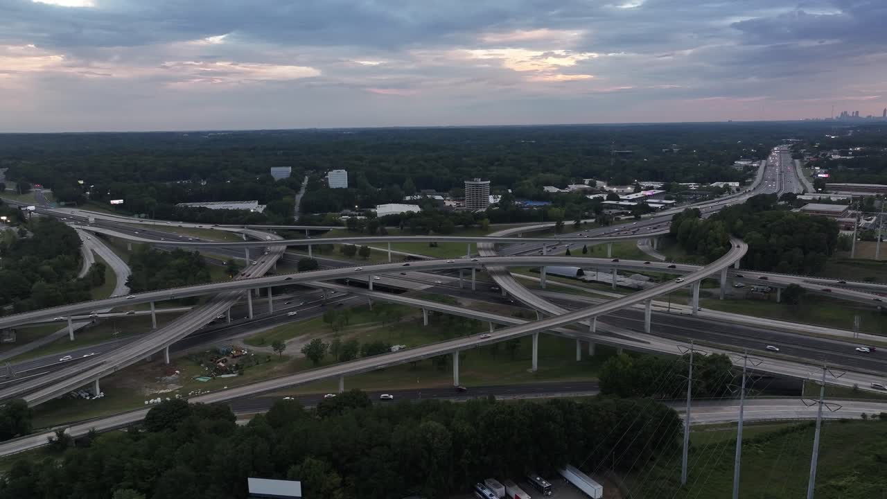 Evening traffic on Spaghetti Junction Interstate corridor, intersection of Interstates 85 and 285 in Atlanta, Georgia, Drone shot