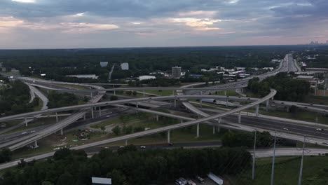evening traffic on spaghetti junction interstate corridor, intersection of interstates 85 and 285 in atlanta, georgia, drone shot
