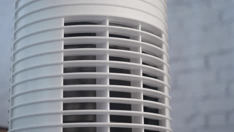 close-up of a white tower air purifier or fan