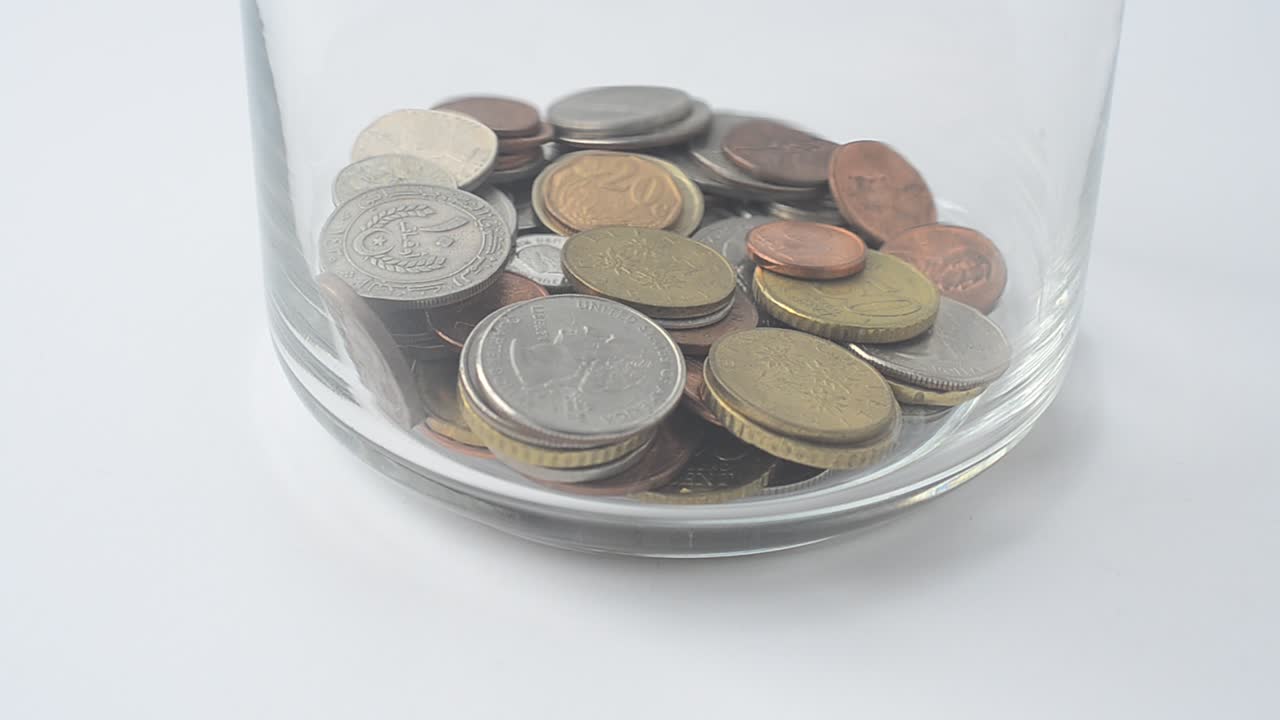 Falling of coins in bank. Coins in bank